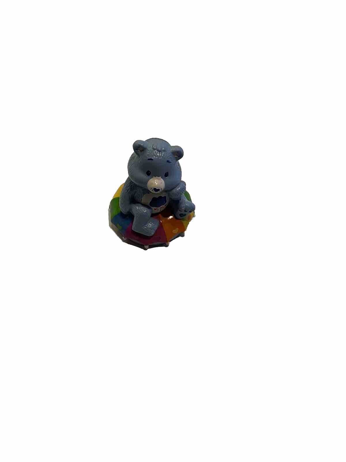 Vintage 1980s Care Bear Coin Piggy Bank w/ Bear sitting on a Rainbow Umbrella