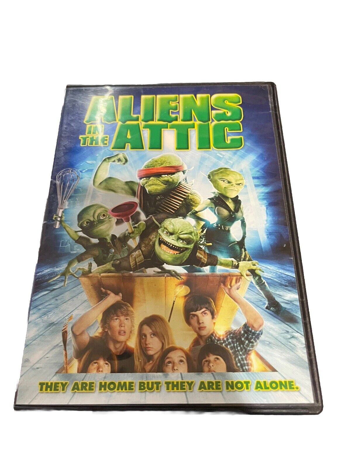 Aliens in the Attic DVD cover featuring animated aliens and kids with the title and tagline