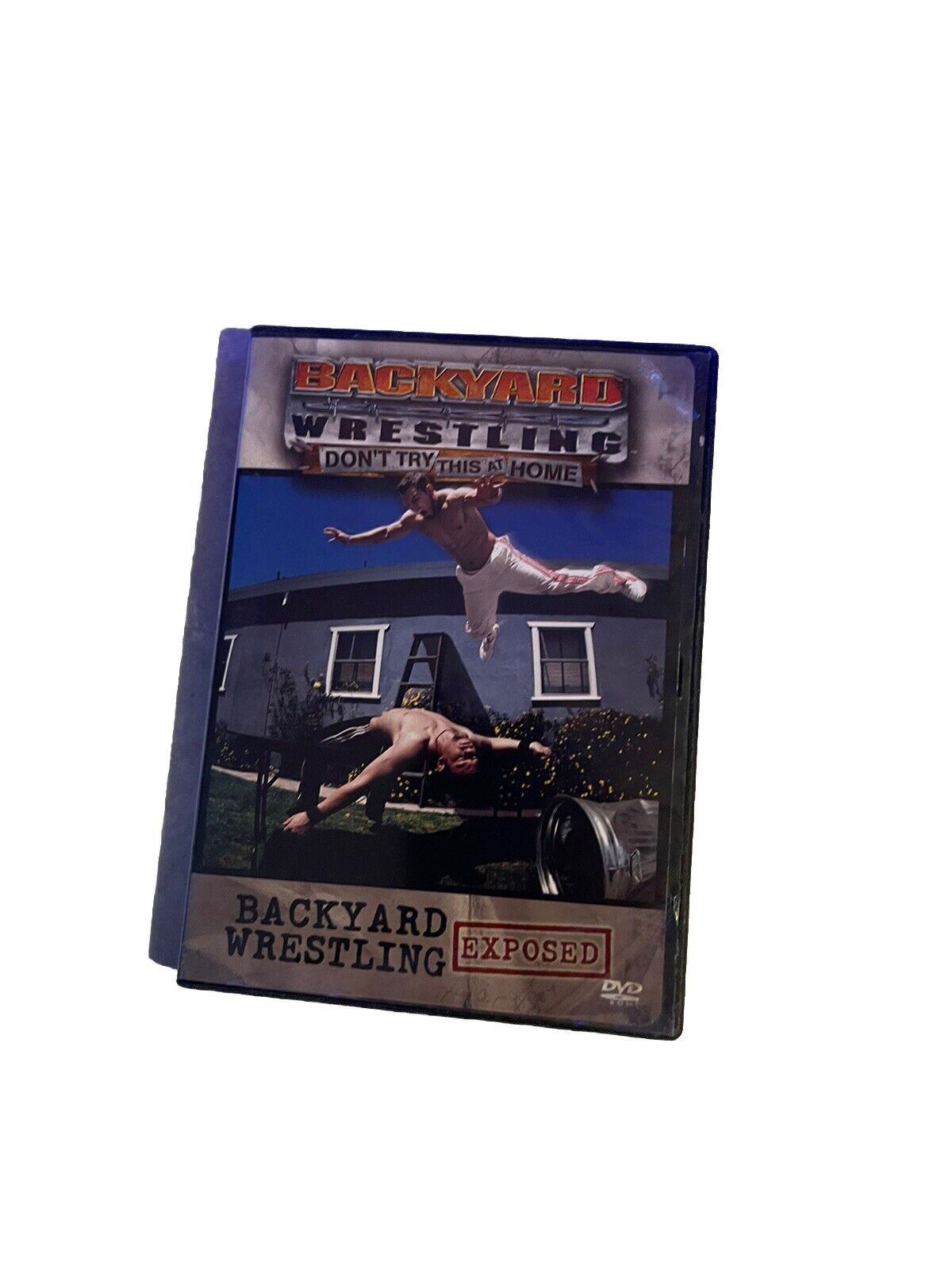Backyard wrestling DVD featuring intense wrestling action and stunts in a backyard setting