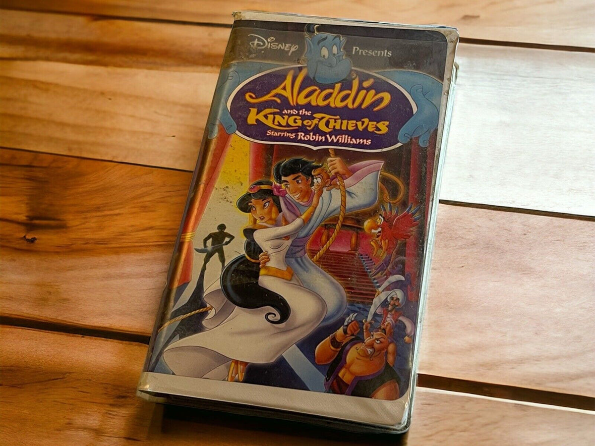 Aladdin and the King of Thieves VHS tape with colorful animated cover featuring Aladdin and Jasmine