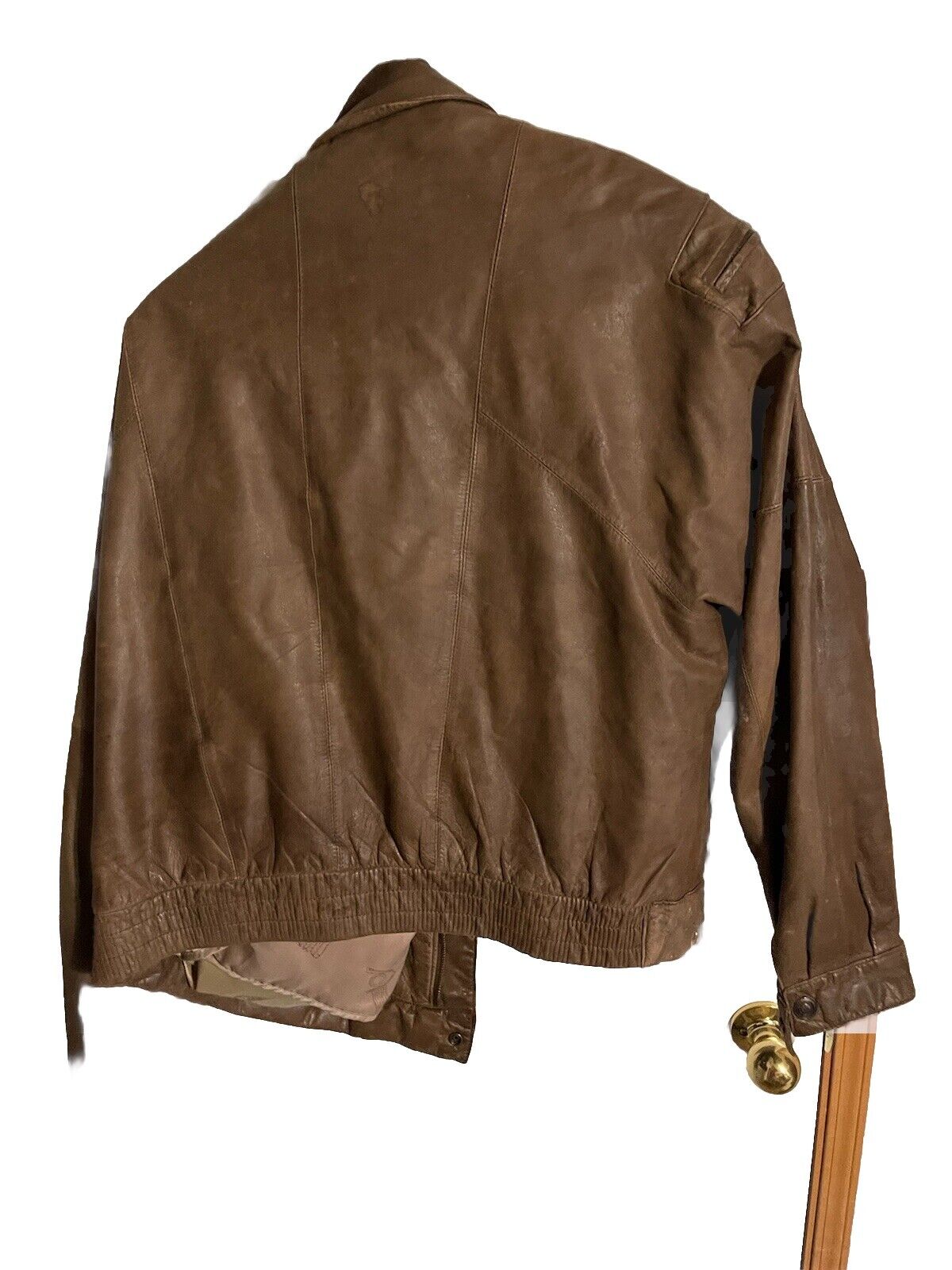 Brown men's leather bomber jacket with elastic waistband and zippered sleeve pocket from 1118 Emporium