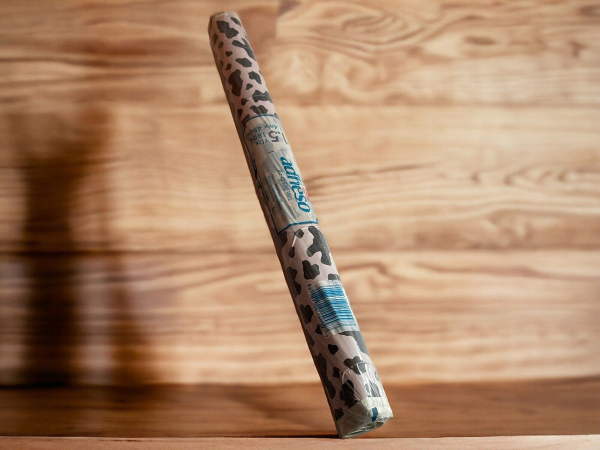 1118 Emporium leopard print self adhesive vinyl roll standing on wooden surface