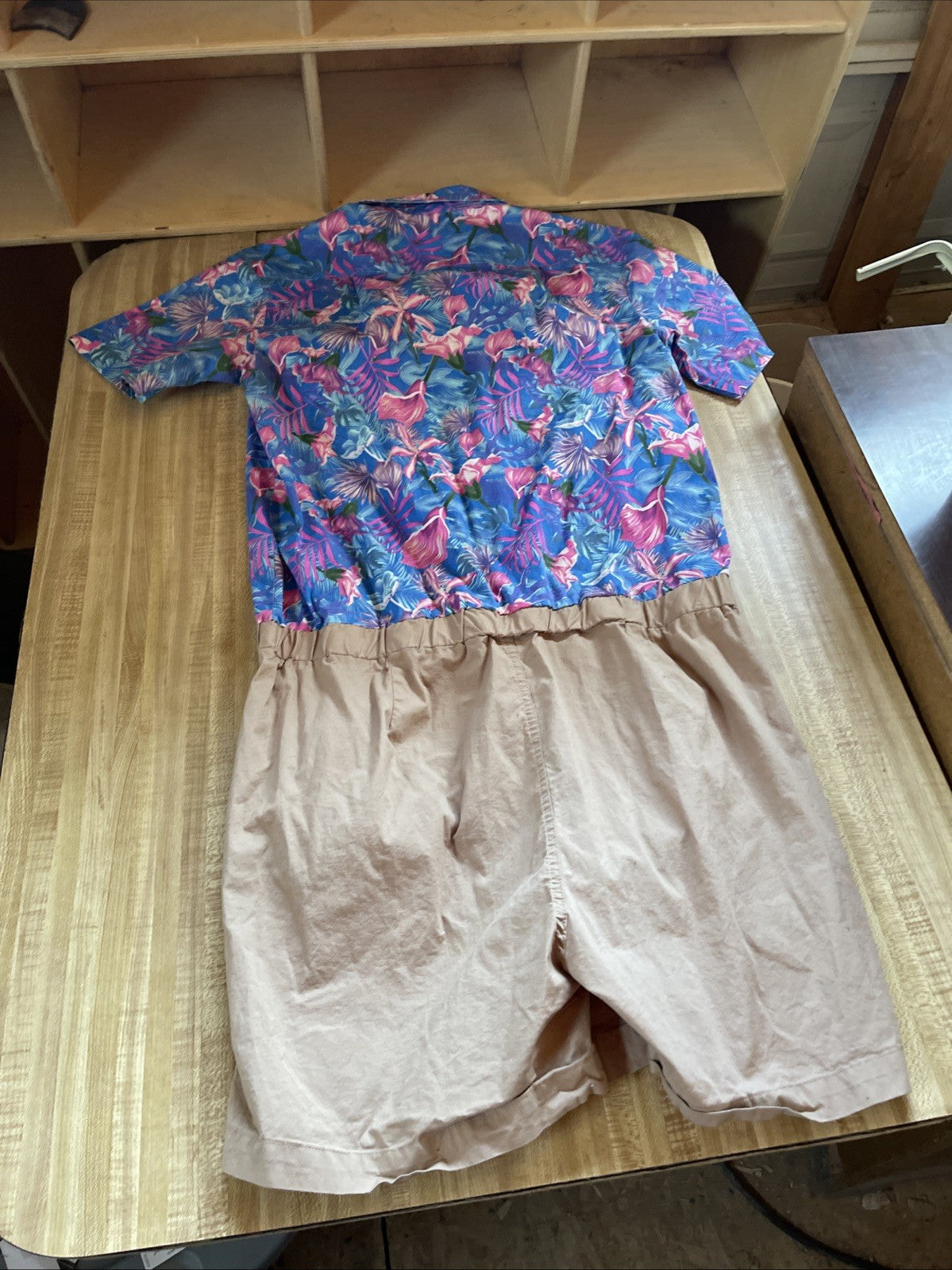 Zesties tropical print romper XL with colorful flamingo and leaf design on top and beige shorts bottom