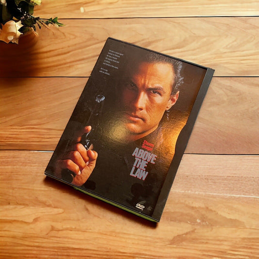 Above the Law DVD 1998 featuring Steven Seagal holding a gun on the cover with dark background