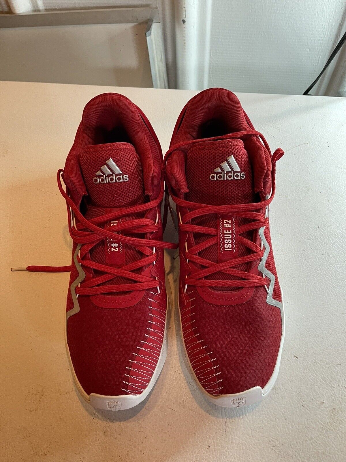 Red adidas D.O.N. Issue 2 size 13 basketball shoes with white accents and lace-up design