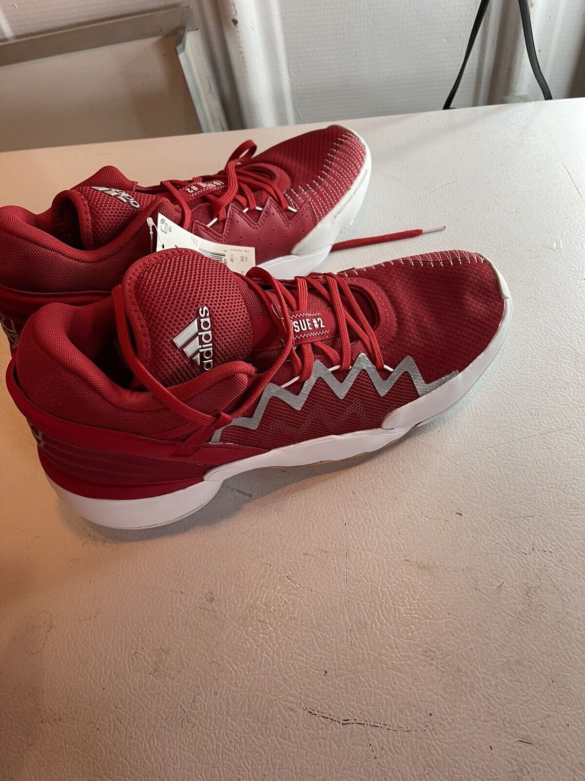 Red adidas d.o.n. issue 2 size 13.5 basketball shoes with white zigzag sole and breathable mesh upper