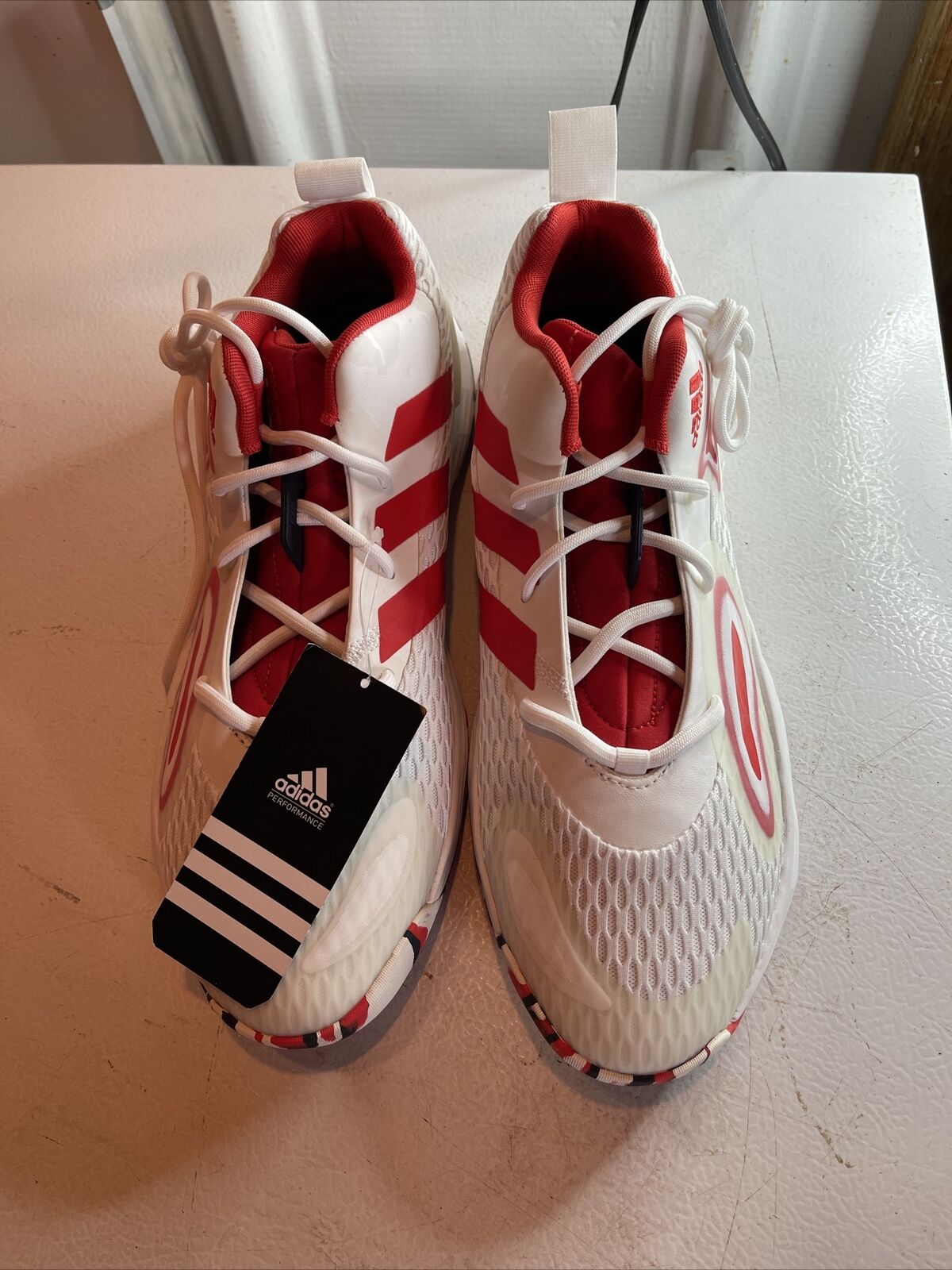 Adidas SM Exhibit A Team USA white and red athletic shoes with tag displayed on white surface