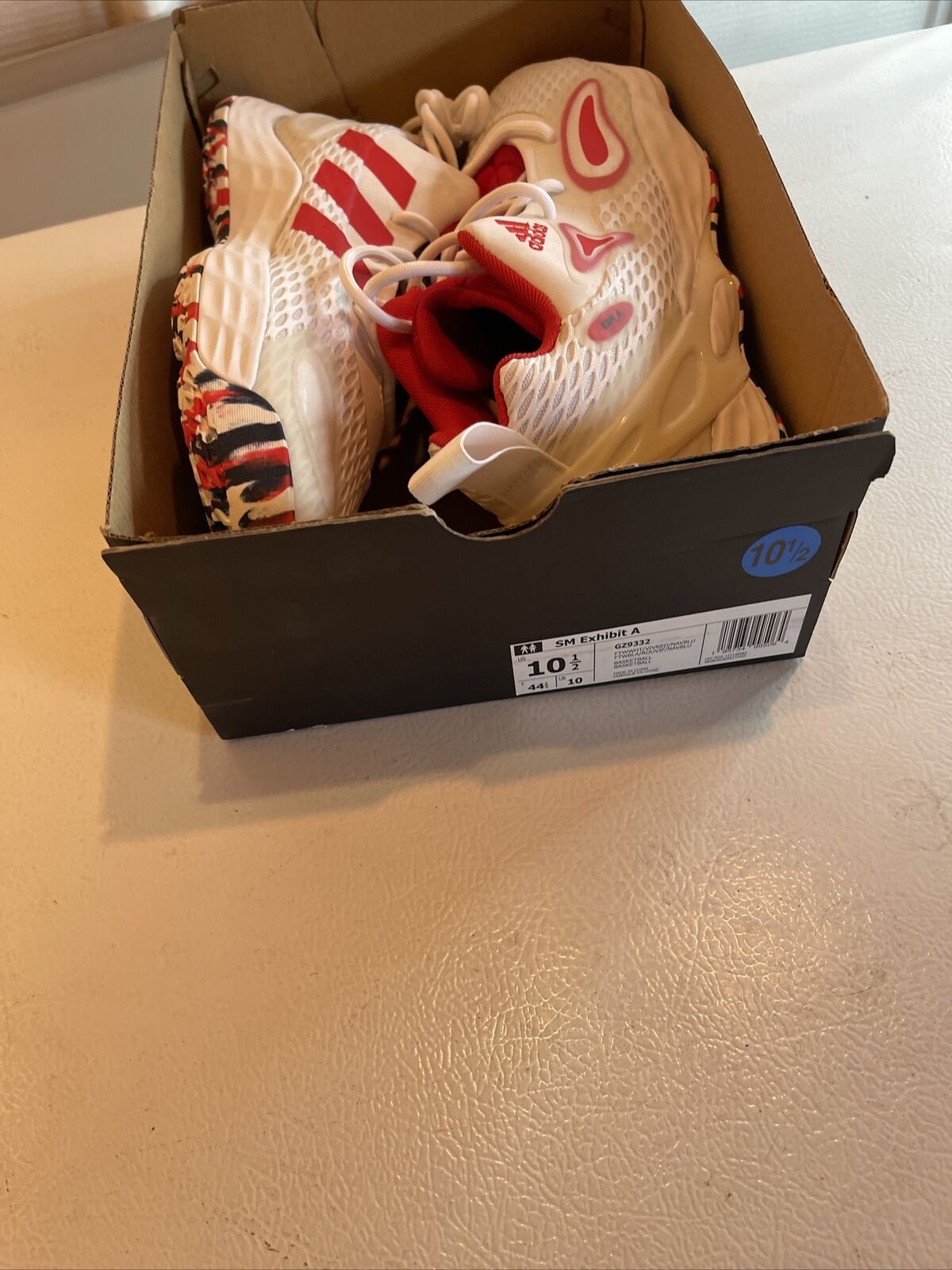 Adidas SM Exhibit A Team USA sneakers in white with red accents inside black shoe box size 10.5