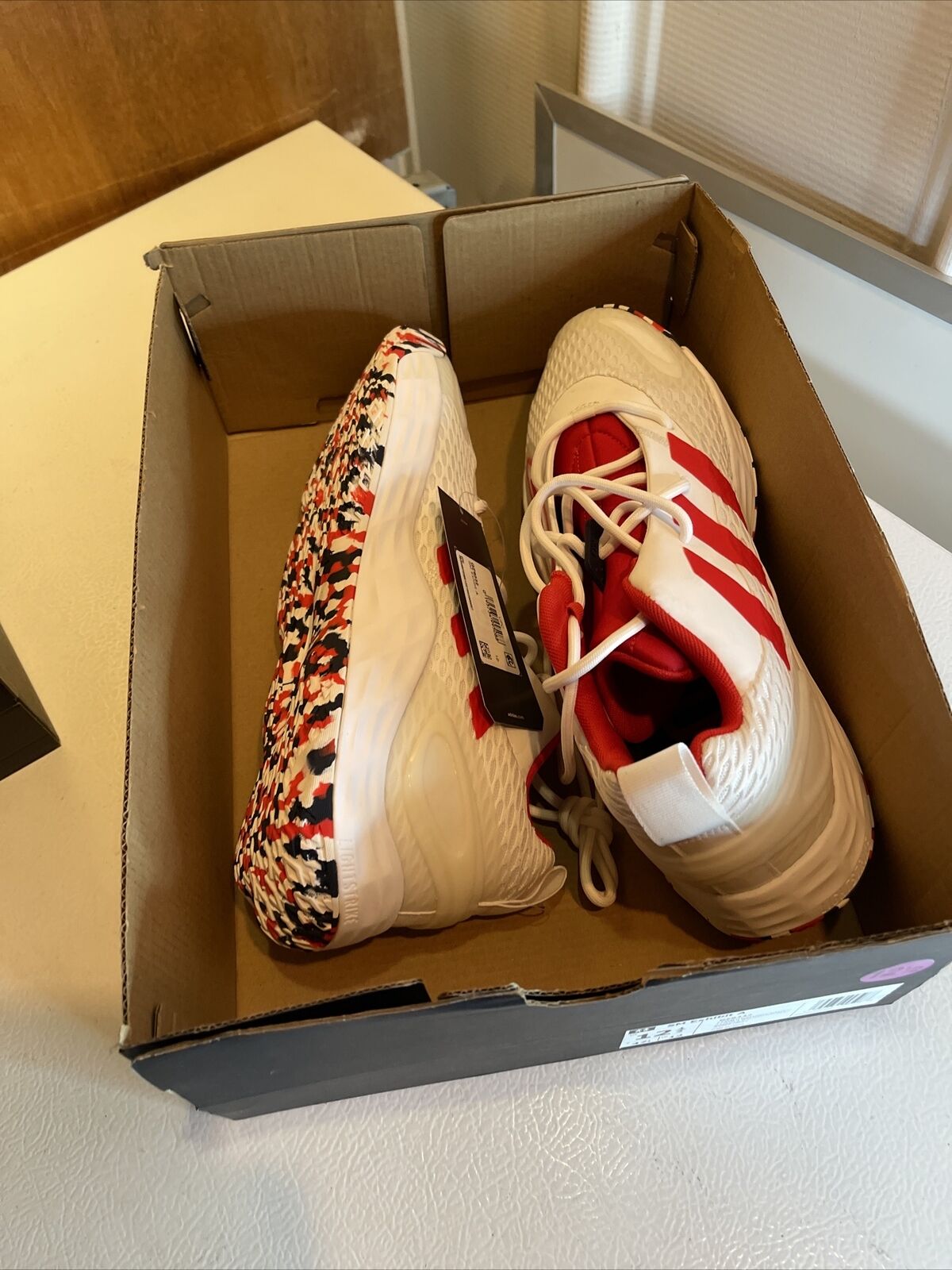 Adidas SM Exhibit A Team USA sneakers white with red stripes and multicolor patterned soles in a cardboard box