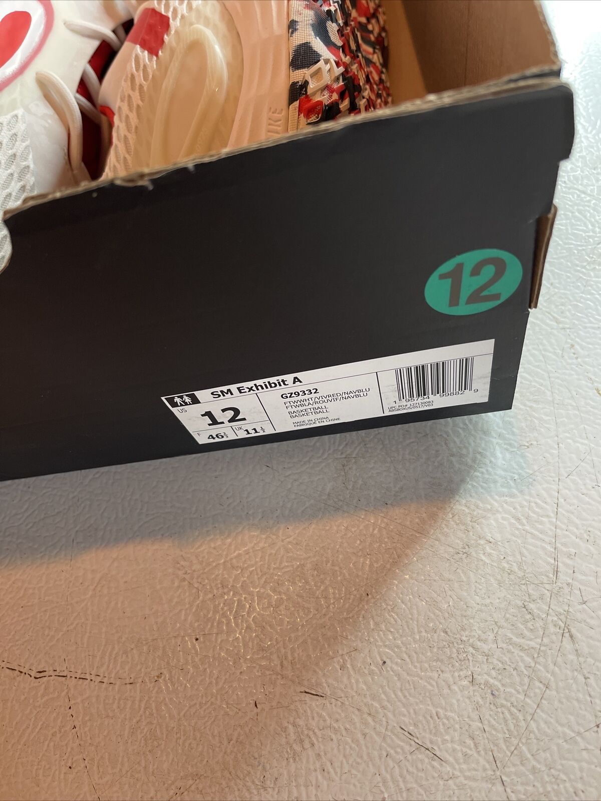 Adidas Team USA sneakers size 12 shoebox with visible size label and part of white and red shoes inside
