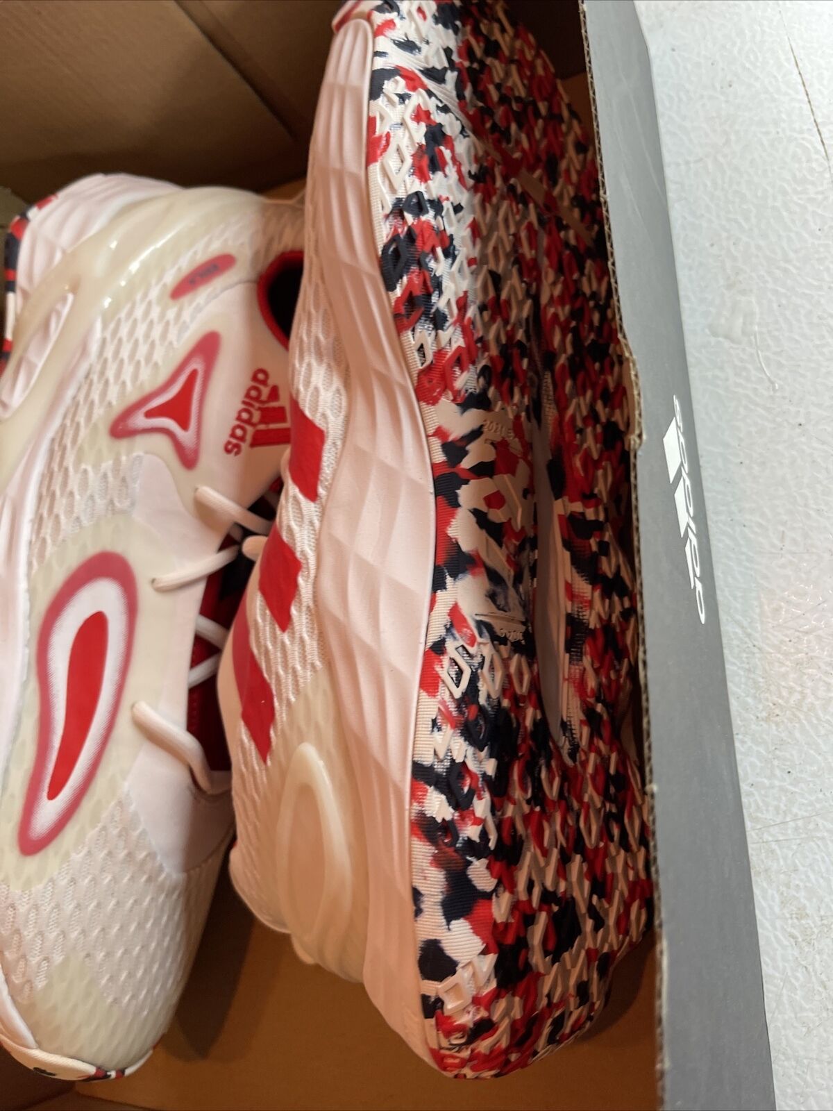 Adidas Team USA sneakers size 12 with red white and blue patterned sole inside black Adidas box