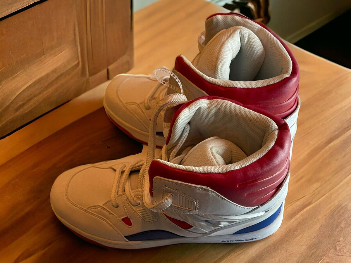 Airwalk men’s sneakers size 10.5 in white with red and blue accents on wooden floor