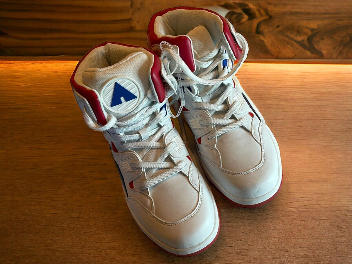 White and red Airwalk men’s sneakers size 10.5 with high-top design on wooden surface