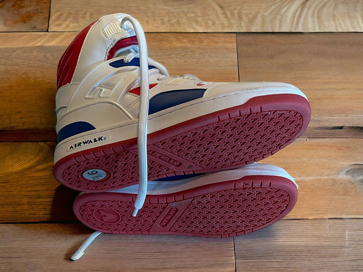 Airwalk men’s sneakers size 9.5 in white red and navy blue with detailed sole view on wooden floor