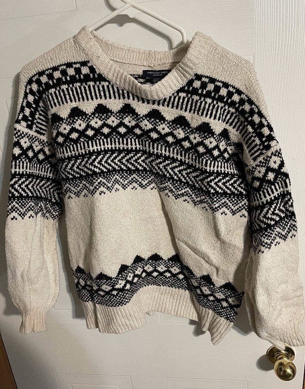 American Eagle sweater XS with black and white geometric patterns on cream knit fabric