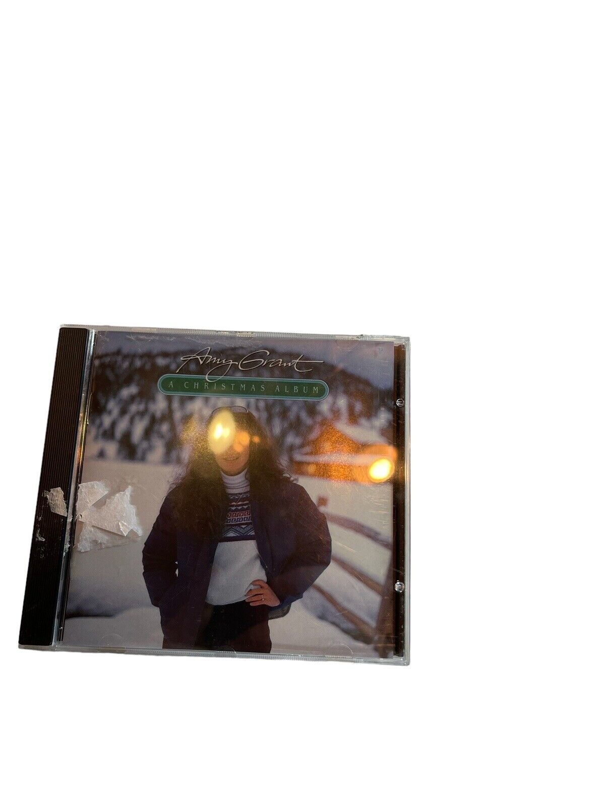 Amy Grant Christmas album CD featuring Amy Grant standing outdoors in winter attire with snow in the background