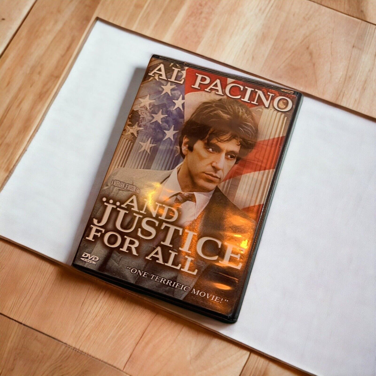 And Justice for All DVD featuring Al Pacino with American flag background on wooden surface