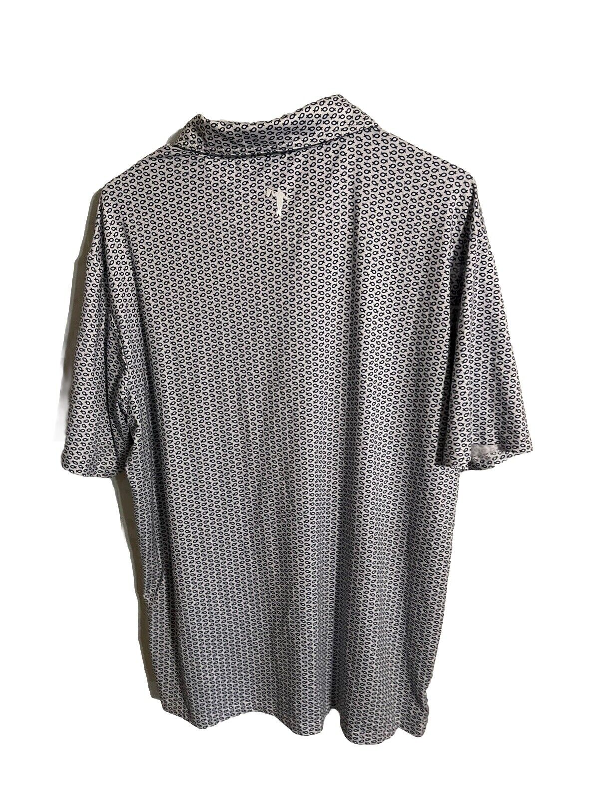 Back view of Anderson Ord golf polo with black and white geometric pattern and collar