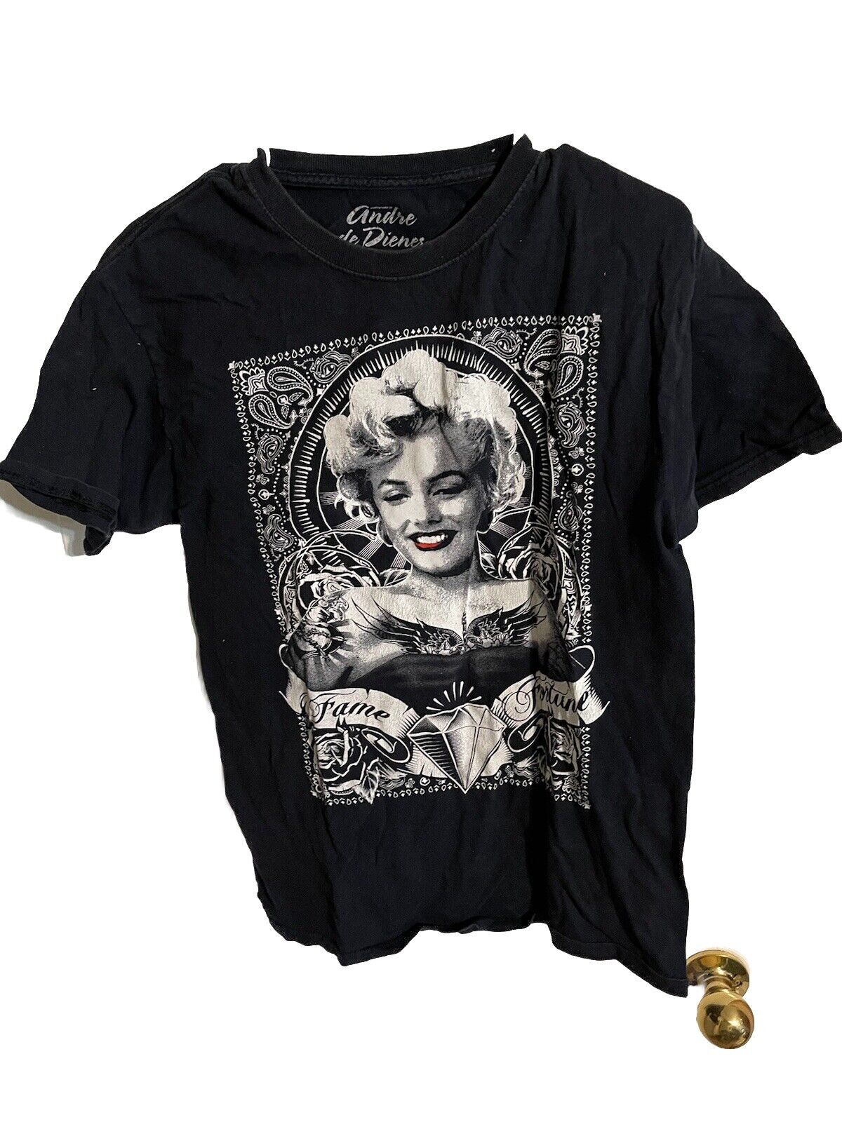 Black Andre De Dienes graphic tee featuring a vintage black and white photo of Marilyn Monroe with artistic design