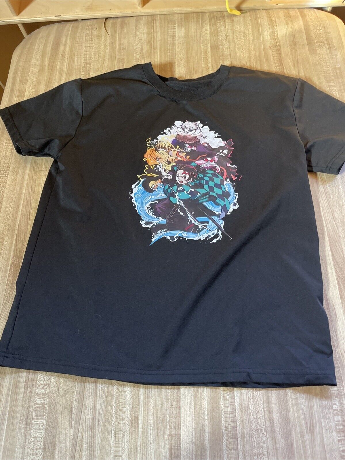 Black anime graphic t shirt medium with colorful Demon Slayer characters printed on front