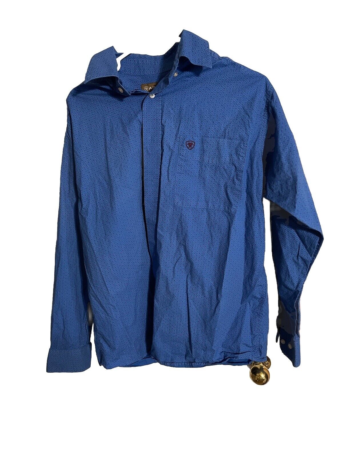 Ariat blue button down shirt with long sleeves and chest pocket featuring small logo
