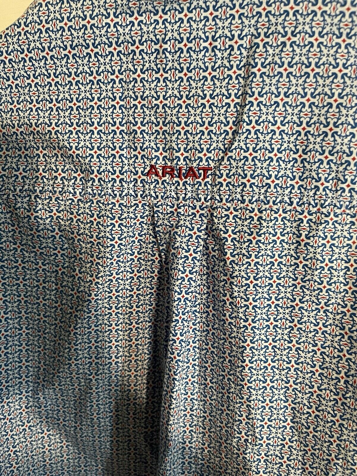 Close-up of patterned fabric on Ariat men's button down shirt showing detailed design and texture