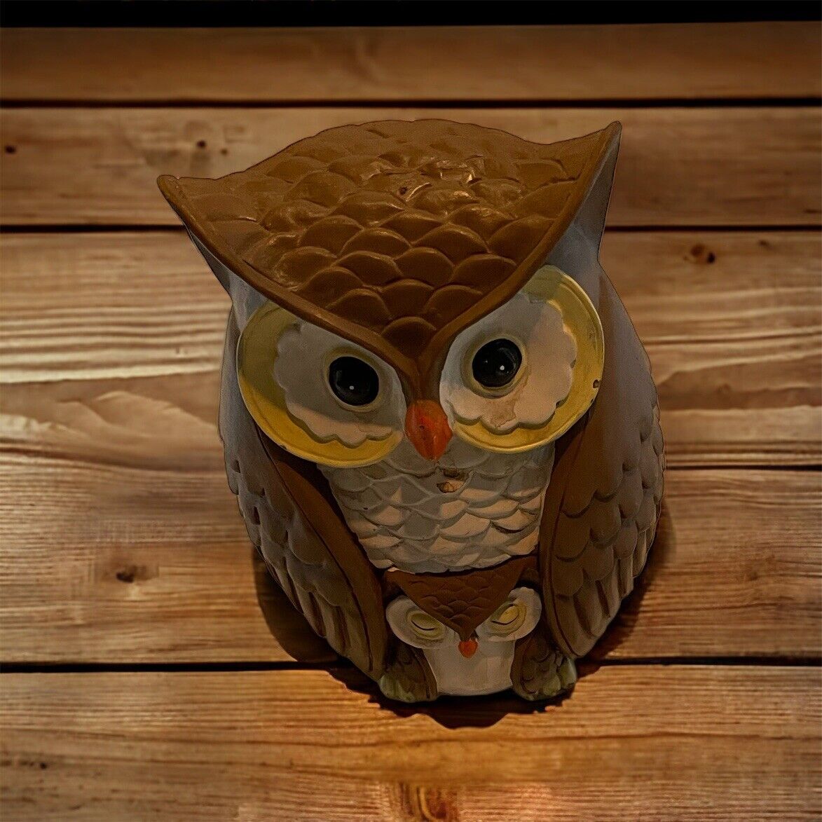 Handcrafted wooden Ashland owl figurine with detailed feathers and large eyes on wooden surface