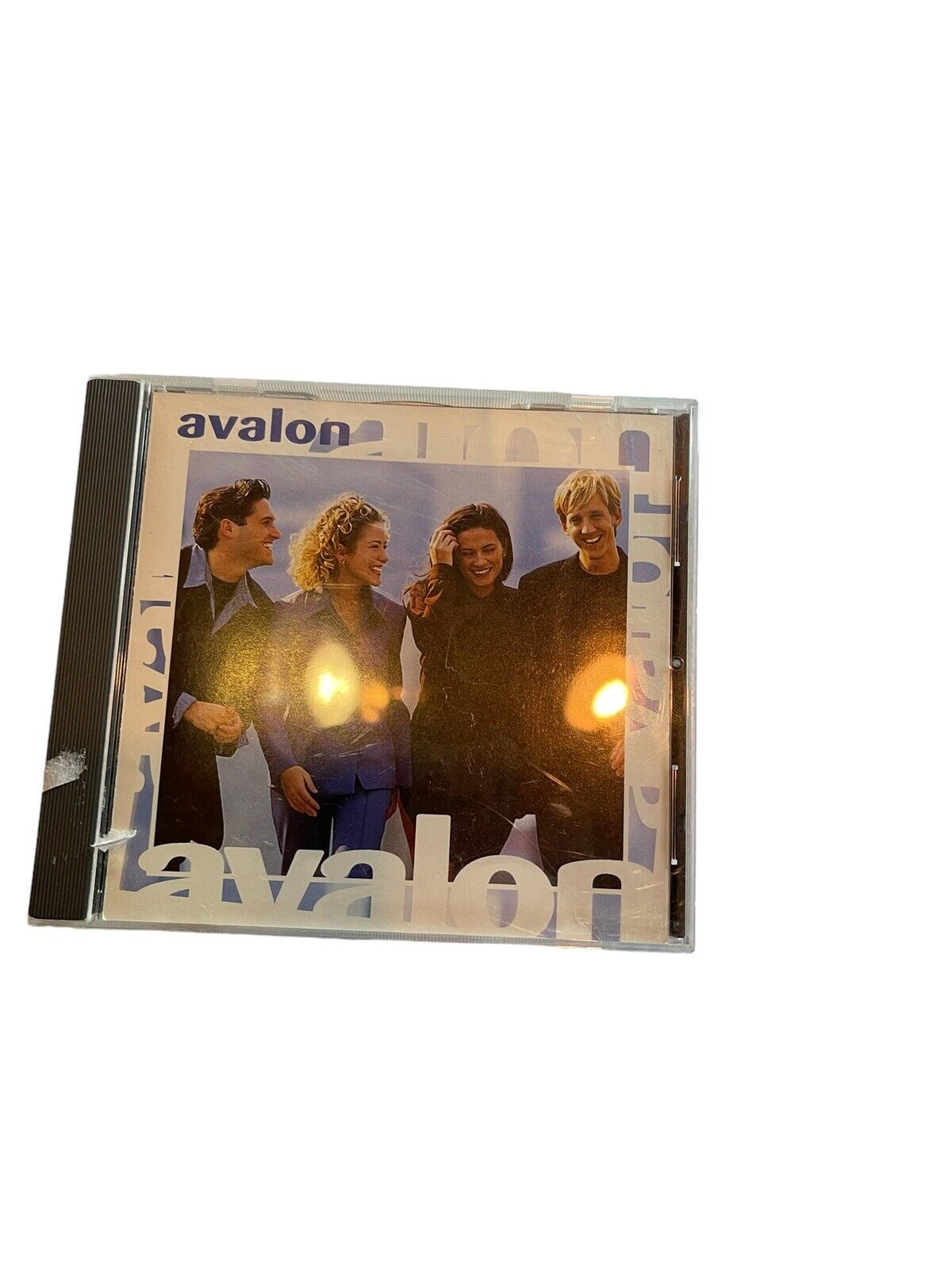 Avalon CD for sale featuring album cover with four smiling band members in casual outfits