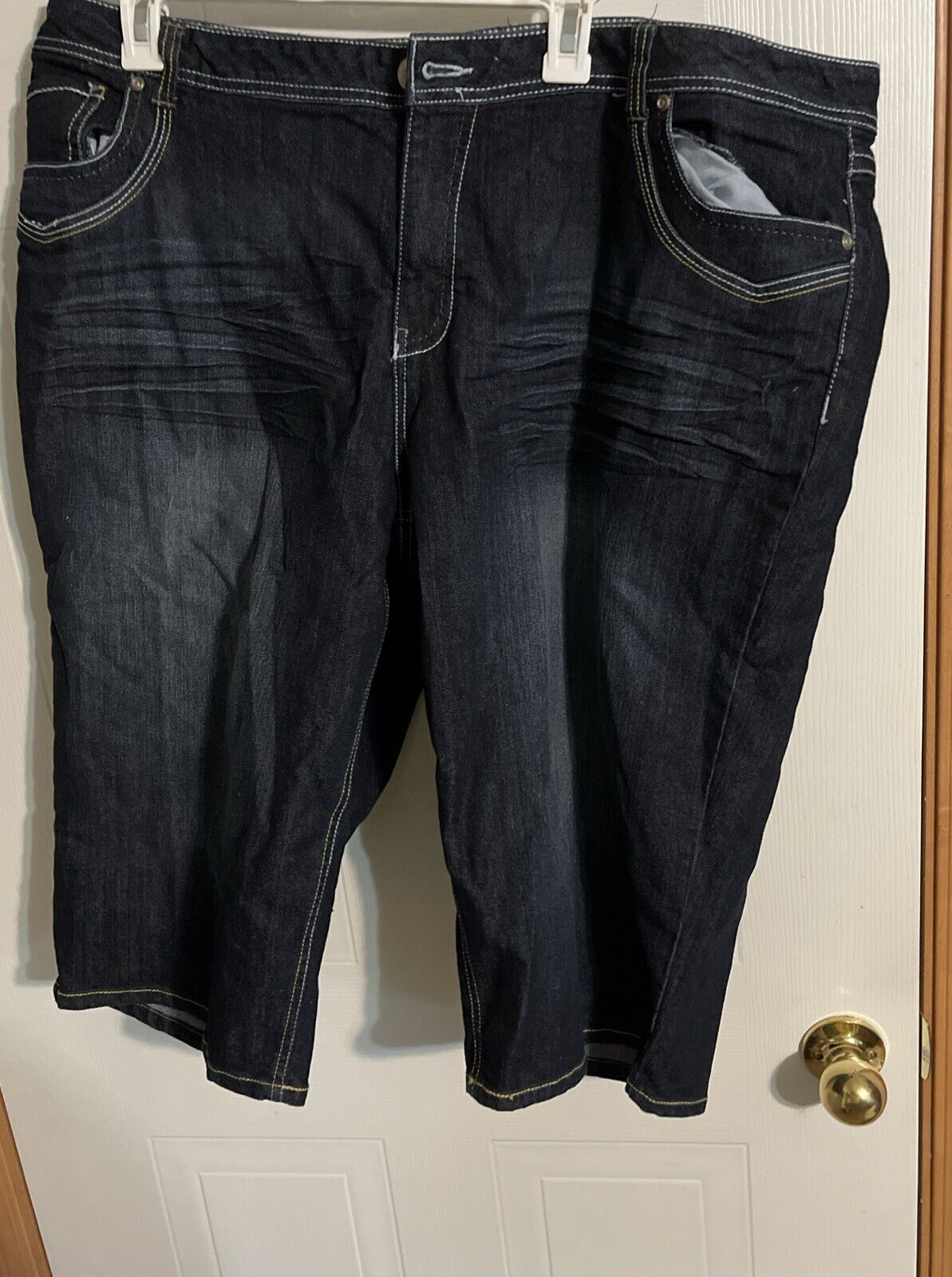 Baccini plus size denim jorts in dark wash with front pockets and casual stitch detailing