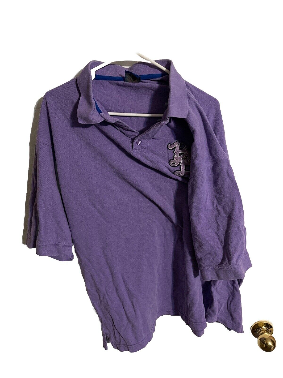 Purple Badboy polo shirt 3XL with short sleeves hanging on a hanger