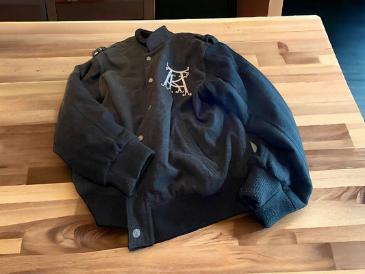 Black XXL hip hop fashion jacket with buttons and white logo on chest by 1118 Emporium
