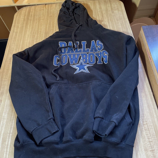 Black Dallas Cowboys hoodie 2XL with front pocket and drawstring hood laid flat on wooden surface