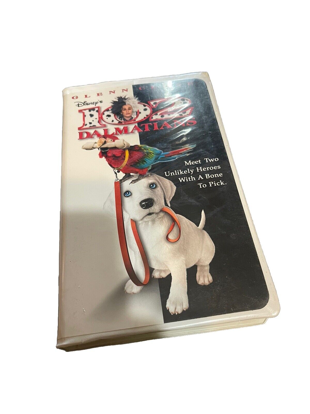 Disney 102 Dalmatians VHS tape with cover featuring a Dalmatian puppy and a colorful parrot