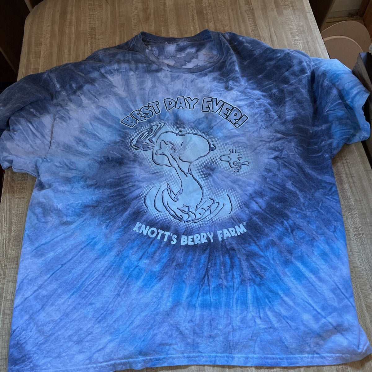 Blue tie-dye Knott's Berry Farm Peanuts T-shirt with Snoopy and Woodstock design and Best Day Ever text