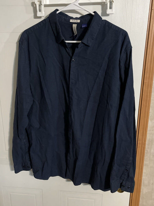 Men's navy button up shirt XL hanging on white hanger against white door background