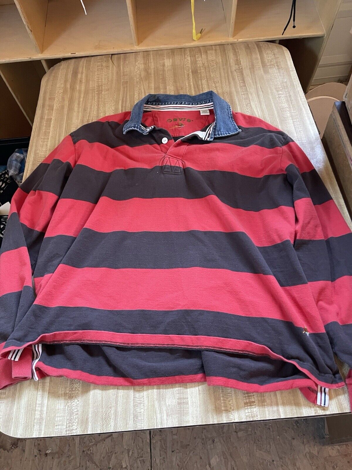 1118 Emporium men's striped rugby shirt XXL in red and black with denim collar laid flat on wooden table
