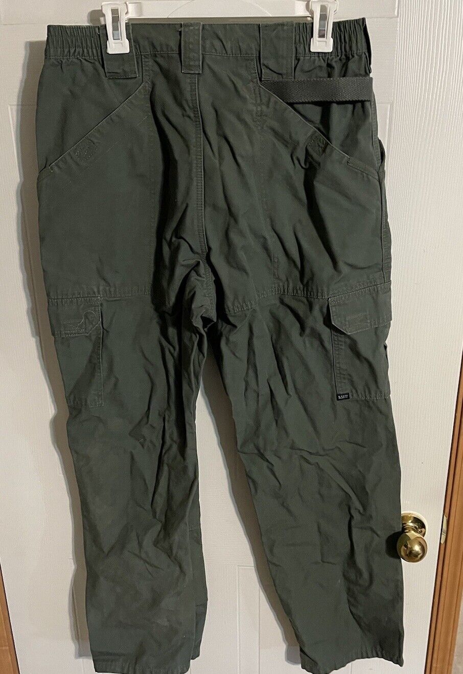 1118 Emporium men's tactical cargo pants in dark green with multiple pockets and adjustable waist