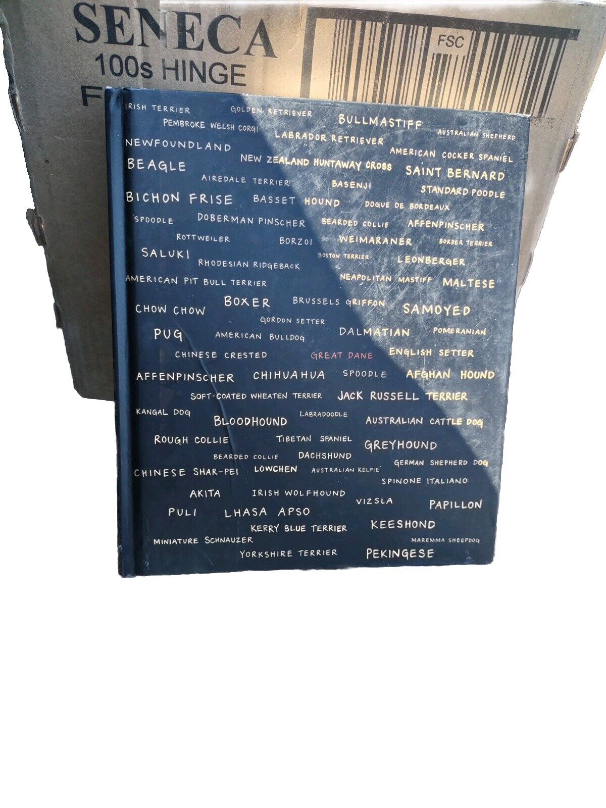 Blue blanket with various dog breed names printed in white text by 1118 Emporium featuring 101 Salivations book