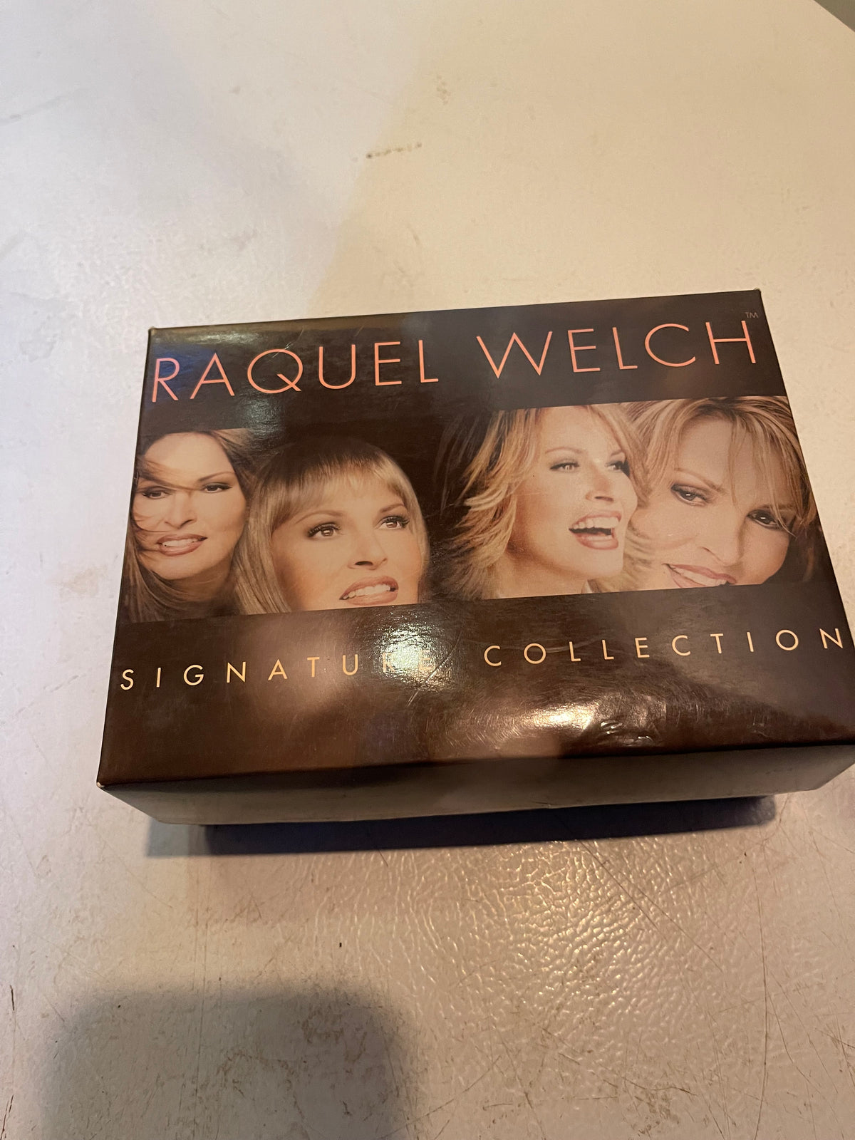 Raquel Welch Signature Collection box featuring luxury women’s wigs realistic styles by 1118 Emporium