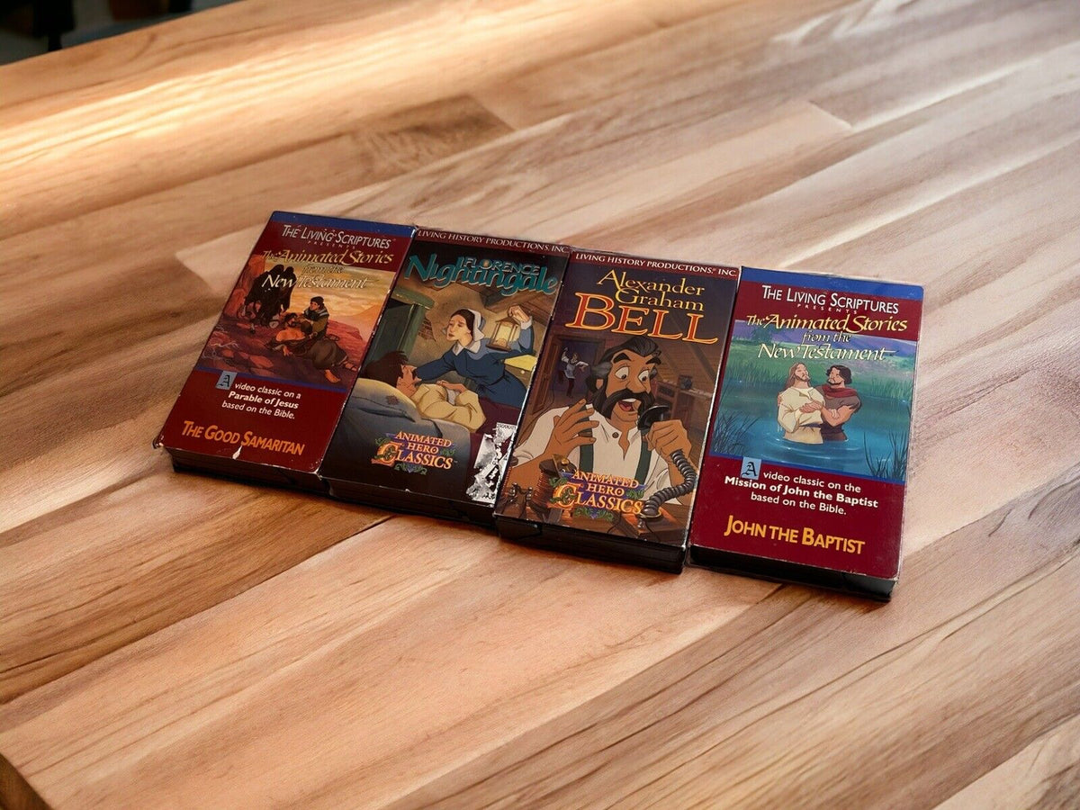 Religious animated VHS lot featuring classic biblical stories on wooden table from 1118 Emporium