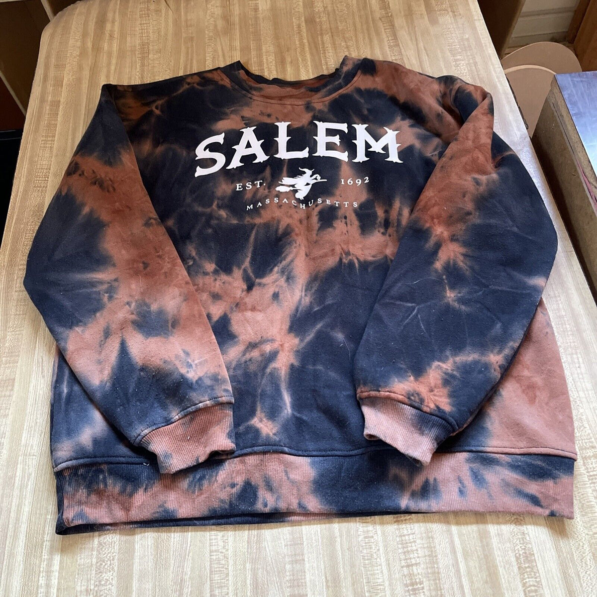 Tie-dye Salem Massachusetts sweatshirt in black and brown with white Salem text and witch graphic