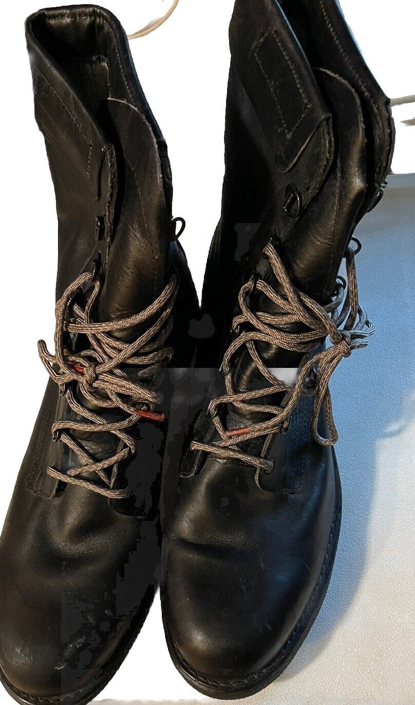 Pair of black vintage Addison combat boots with detailed lacing and worn leather finish