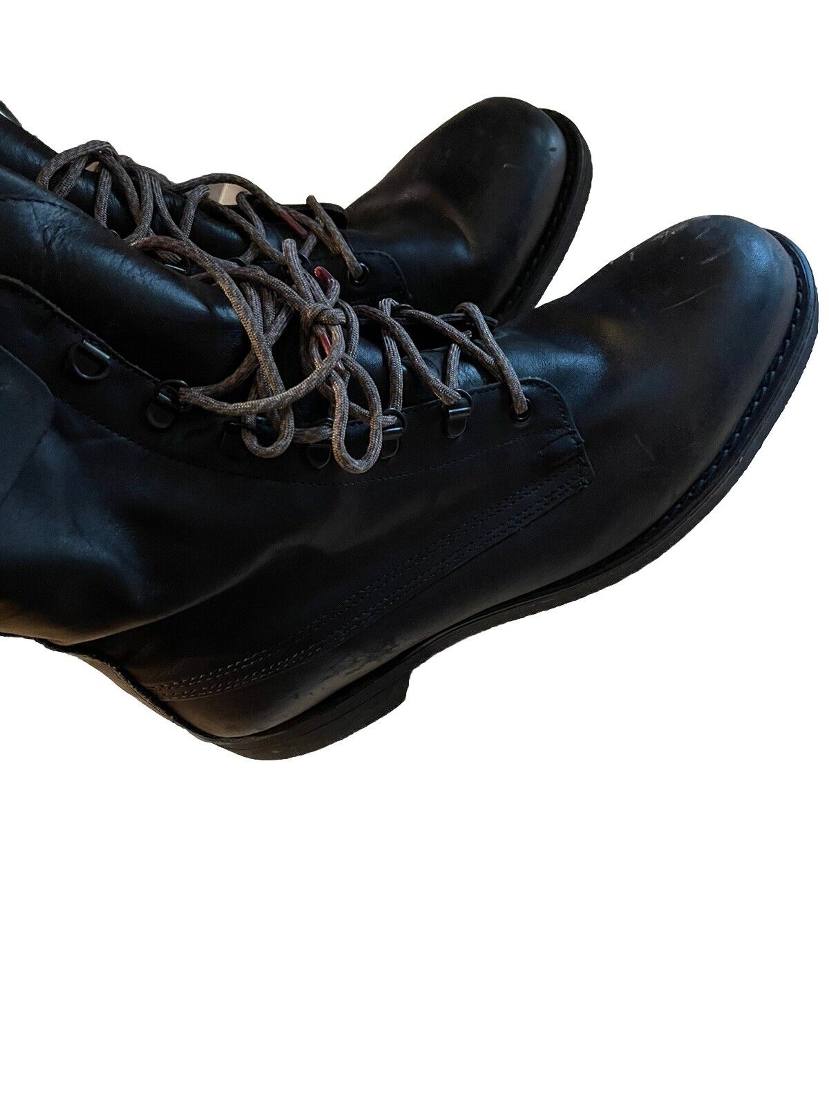 Black leather vintage Addison combat boots with worn laces and detailed stitching