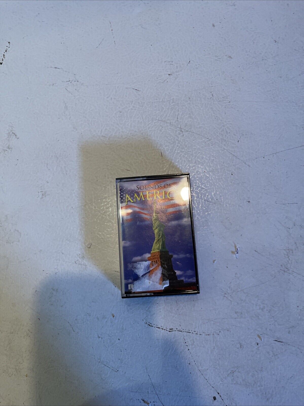 1118 Emporium vintage patriotic music cassette featuring Statue of Liberty and American flag cover art