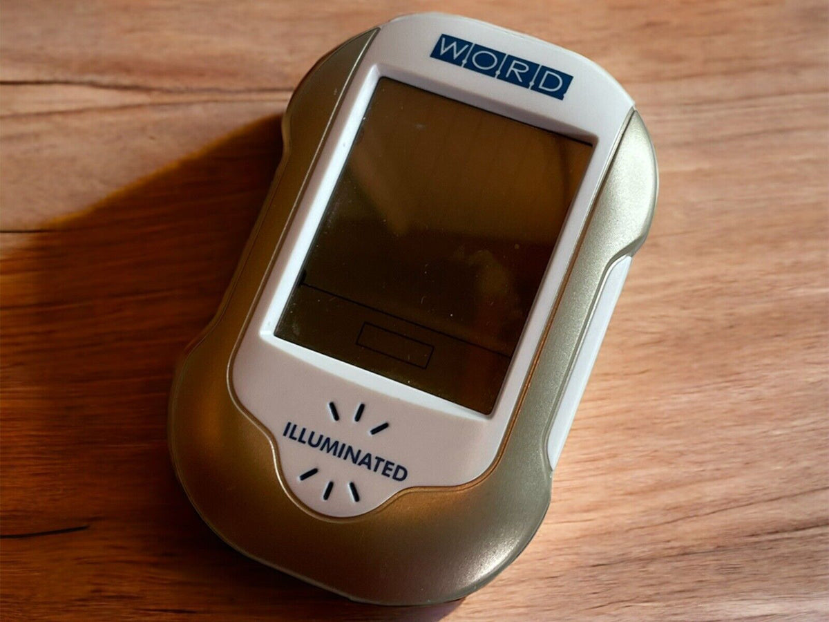 2007 handheld word puzzle electronic game with illuminated screen and compact silver design