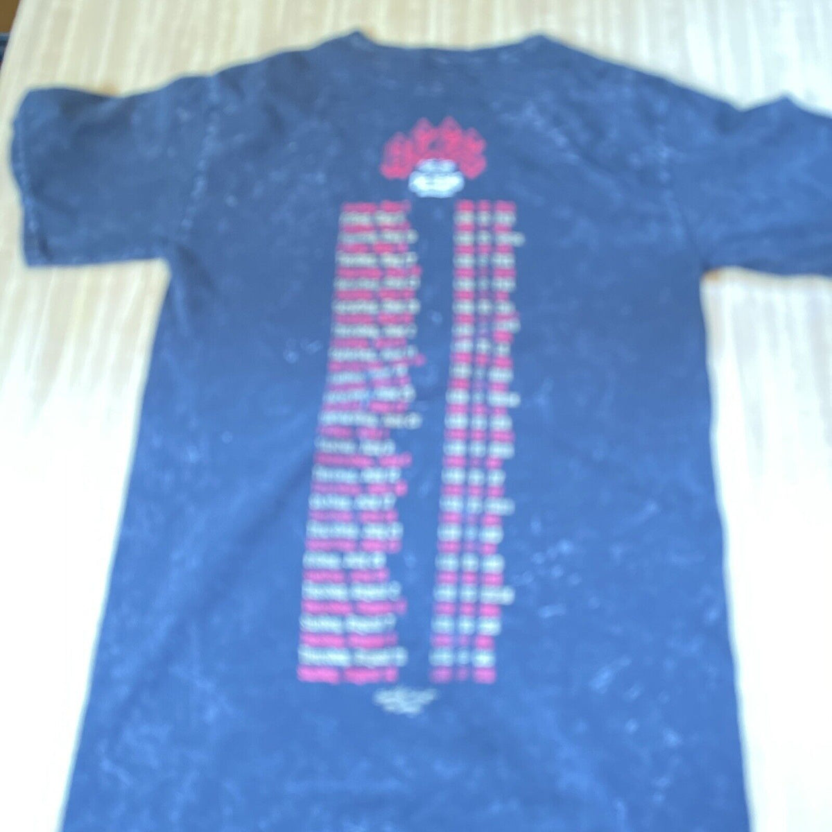 Blue Las Vegas Aces t shirt with team logo and player names printed on the back
