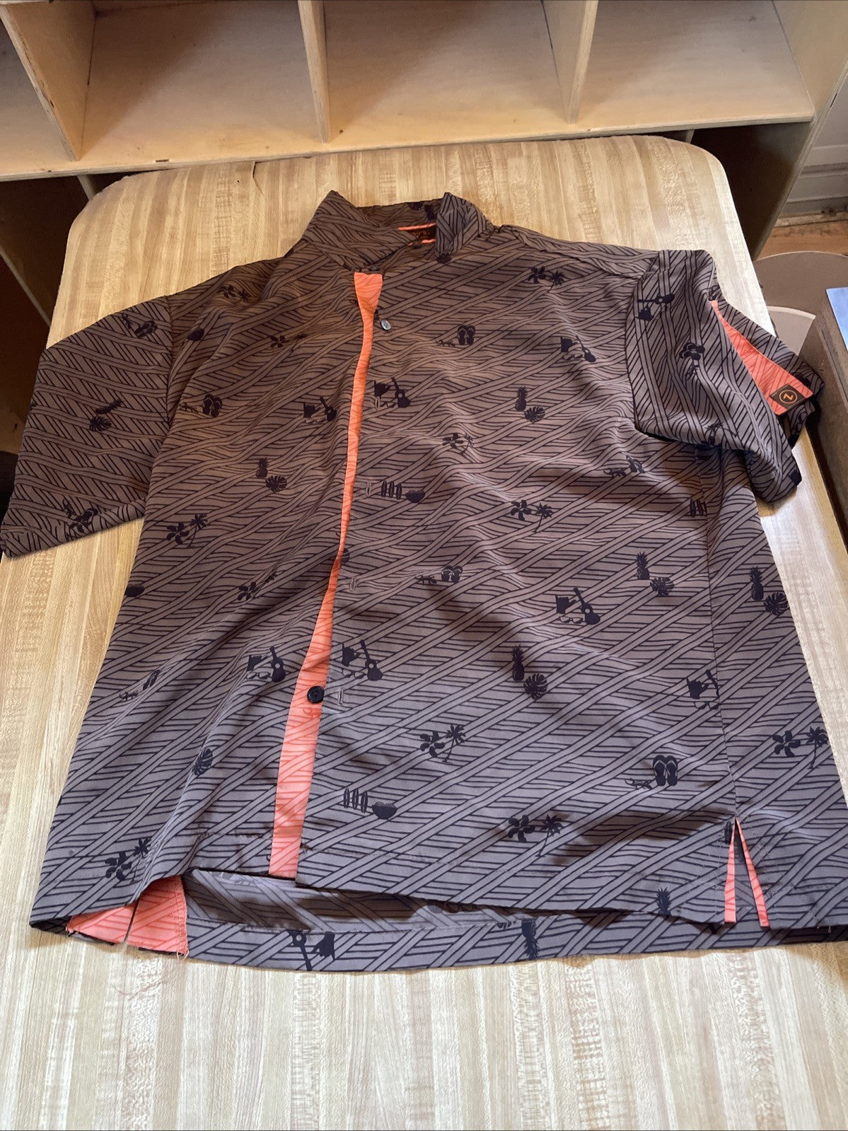 Zippy's Hawaiian shirt large with geometric and floral patterns in brown and orange accents